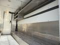 Interior of a 2017 Freightliner MT45 with metal benches and shelves on the walls