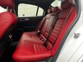 Interior of a 2023 Alfa Romeo Giulia featuring red leather rear seats with a sleek design and adjustable headrests