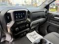 Interior of a 2019 Chevrolet Silverado 1500 featuring a touchscreen display dashboard and controls with a floor mat that says thank you