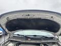 The underside of the hood of a 2016 Ford Explorer showing the latch and various components