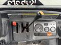 Dashboard of a 2011 Kubota RTV 1140 CPX featuring gear shifter lever gauges and warning lights