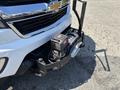 A 2017 Chevrolet Colorado with a front winch mounted on a black bumper and a chrome grille featuring the Chevrolet logo
