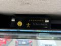 A black device labeled "The Safety Director" with indicator lights and a power switch mounted on a vehicle's overhead console
