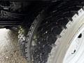 Close-up of two tires on a 2015 Hino 195 showing their tread pattern and durability