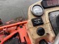 Close-up of the control panel of a 2010 Kubota F3680 featuring a gauge and hour meter with visible wear and tear