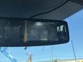 A rearview camera display showing a view of the road behind a 2017 Ford Transit-350