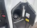 A 2021 Ford Transit-350 fuel filler neck with the cap removed and instructions for fueling visible inside the fuel door