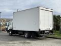A 2008 International CityStar box truck with a white cargo area and black chassis parked with its rear facing the viewer