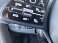 Close-up of the control panel with buttons for setting cruise control in a 2022 Mercedes-Benz Sprinter