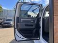 The image shows the open driver's side door of a 2014 RAM 5500 revealing the interior handle and window controls