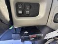 A close-up of the dashboard controls in a 2008 International 4400 featuring switches labeled ON PARKD REGEN and INHIBT REGEN along with a CURT Trailer Flex device mounted below
