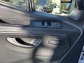 Close-up of the interior door panel of a 2024 Mercedes-Benz Sprinter 2500 featuring window controls and a door handle
