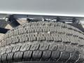Close-up of a worn tire tread from a 2023 RAM Promaster 3500 showing distinct patterns and small debris embedded in the rubber