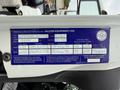 A blue manufacturer label with vehicle specifications for a 2012 International TerraStar including VIN capacity and tire sizes