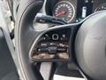 Close-up of the steering wheel controls of a 2020 Mercedes-Benz Sprinter 2500 featuring buttons for cruise control and navigation settings