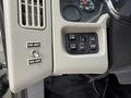Dashboard controls of a 2012 International TerraStar featuring buttons for plow lights head lights and panel lights