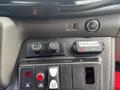 Control panel of a 2021 Ford Transit-350 featuring various switches including air conditioning and door ajar indicator