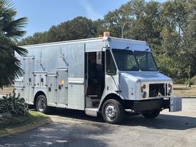 A 2008 Workhorse W62 truck with a silver metallic exterior featuring multiple compartments and a front-mounted grille