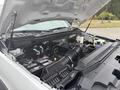 2023 Ford F-450 Super Duty engine with visible components such as air intake battery and fluid reservoirs
