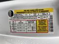A 2020 Ford F-150 tire information label detailing seating capacity tire sizes and recommended cold tire pressure