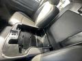 Interior view of a 2012 RAM 2500 showing the center console with a removable tray and storage compartments