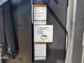 2019 Ford F-550 with a Tommy Gate lift attachment displaying safety and capacity warning labels