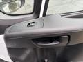 Close-up of the interior door handle and control panel of a 2023 RAM Promaster 3500