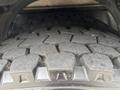 Close-up of a textured tire tread of a 2017 Autocar Xpert showcasing deep grooves and hexagonal patterns designed for traction and durability