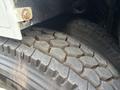 A close-up view of the rugged tire tread of a 2012 International DuraStar 4300 showing its deep grooves and durable design for enhanced traction