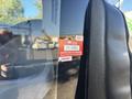 A 2017 Ford Transit-350 with a red certificate of approval sticker attached to the driver's side window