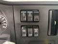 Dashboard controls of a 2025 Peterbilt 536 featuring buttons for on off set resume disable and manual functions