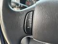 Close-up of a steering wheel control switch from a 2013 Ford E-350 Super Duty with "ON" and "OFF" settings