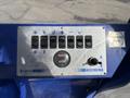 Control panel of a 2023 Bitimec SC415 featuring switches dials and a digital display for operation functions
