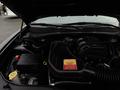 An open hood of a 2017 Dodge Charger displaying the engine compartment with visible components including the battery and air intake system
