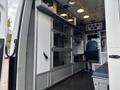 Interior of a 2020 Mercedes-Benz Sprinter 2500 with storage cabinets seating area and control panels designed for utility and comfort