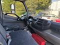 Interior view of a 2018 Hino 195 showing the driver's seat dashboard gear shifter and steering wheel