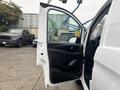 A 2021 Mercedes-Benz Metris with its driver's side door open showcasing the interior door design and controls.
