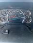 Dashboard of a 2011 Chevrolet Express showing speedometer fuel gauge and odometer with readings in kilometers