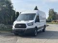 A 2016 Ford Transit 150 van with a white exterior and large front grille parked on a driveway