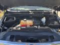 The image shows the engine compartment of a 2015 RAM 1500 featuring a V8 engine air filter battery and various fluid reservoirs