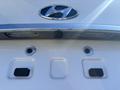 A 2015 Hyundai Sonata rear view camera and sensors mounted on the trunk of the vehicle
