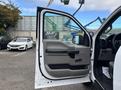 2020 Ford F-150 with an open driver's side door showing interior features and controls