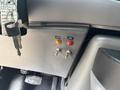 A close-up of the control panel in a 2008 Ford Econoline showing two toggle switches labeled Liftgate and Dome with orange and red indicator lights