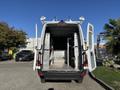 A 2024 Mercedes-Benz Sprinter 2500 with an open rear door revealing the interior shelving and cargo space