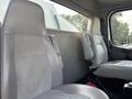 Interior of a 2010 Freightliner M2 106 featuring two grey leather seats with a simple design