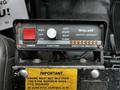 A control panel for a Whelen Traffic Advisor featuring buttons for function selection and a power switch