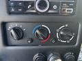 Controls for temperature and ventilation with dials and buttons in a vehicle's dashboard