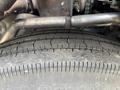 Close-up of a treaded tire from a 2011 Autocar Xpeditor showing detailed surface grooves and wear patterns