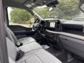 Interior of a 2023 Ford F-450 Super Duty showing front seats dashboard and infotainment system