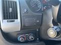 Dashboard controls and climate settings of a 2020 RAM ProMaster 3500 with buttons and dials for air conditioning and fan speed